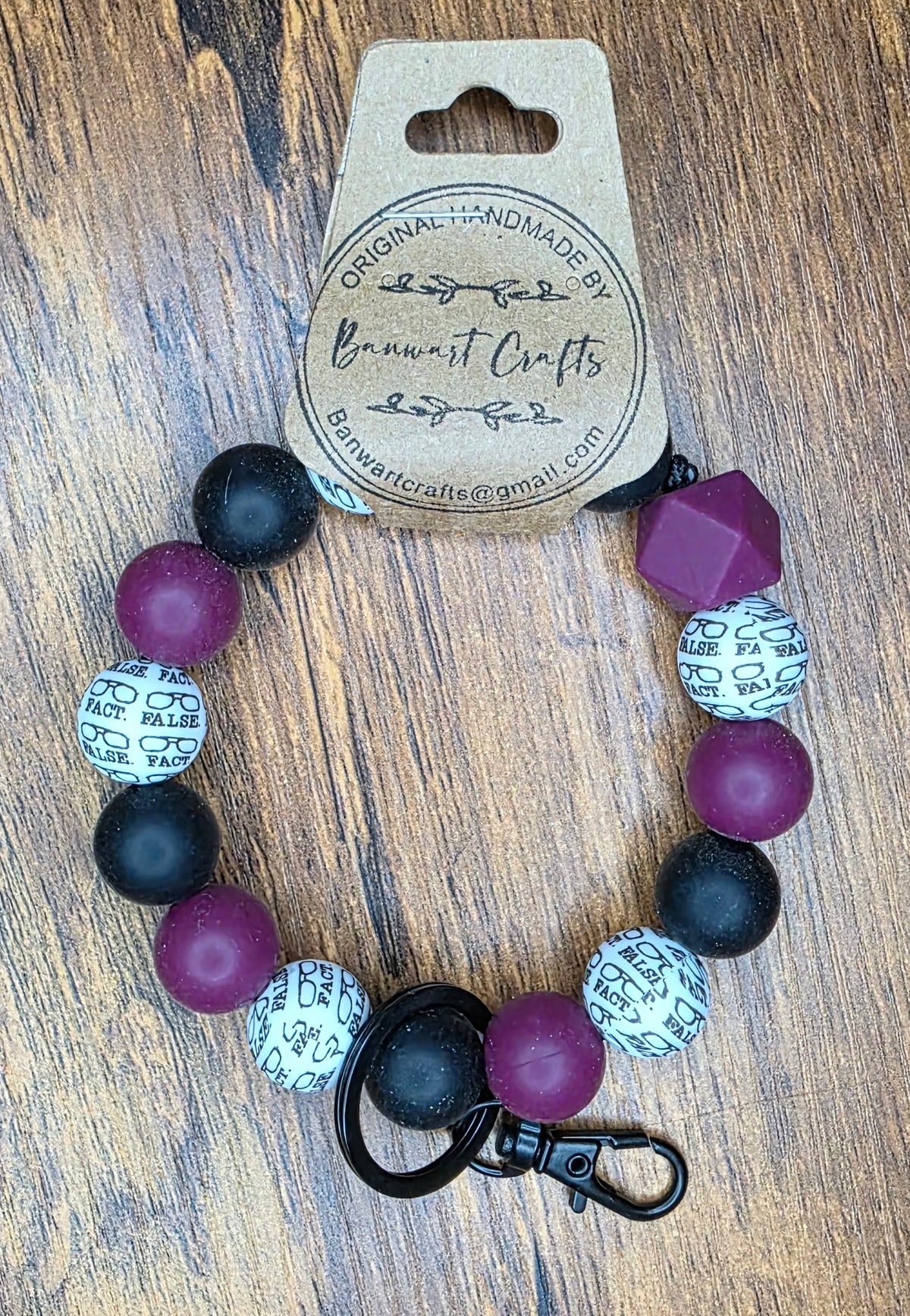 Wine, black, the office wristlet