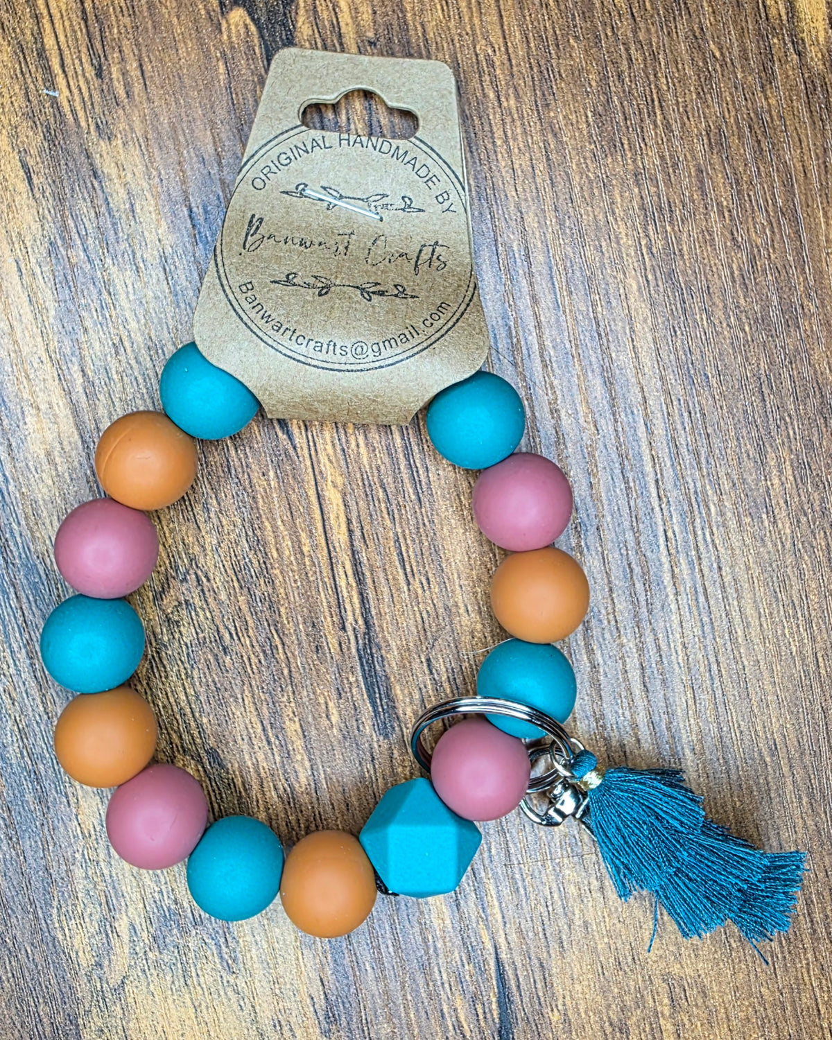 Teal, mauve & rust wristlet